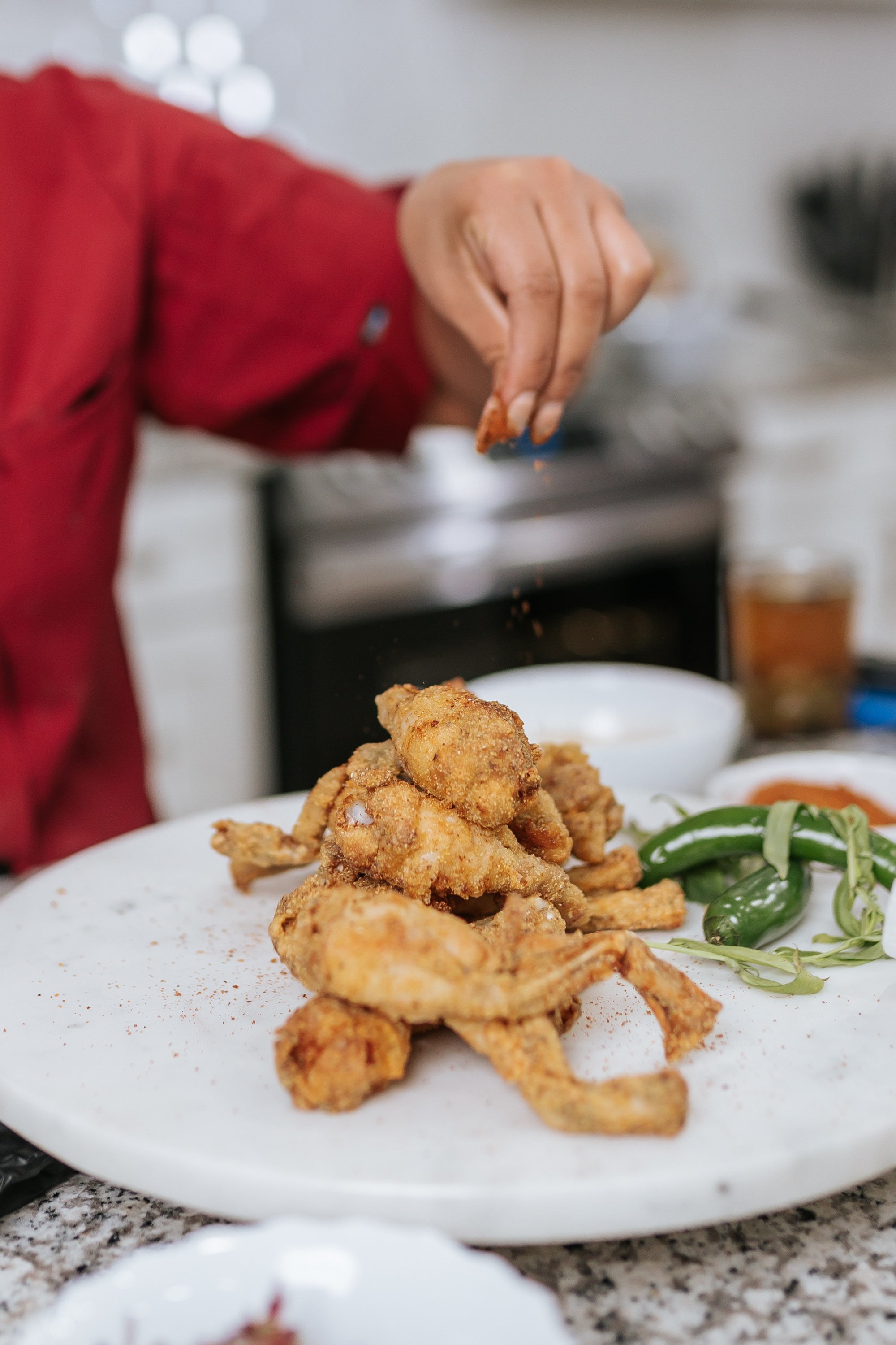Le Rouge Cuisine's Chef putting on the finishing touches to seafood dish